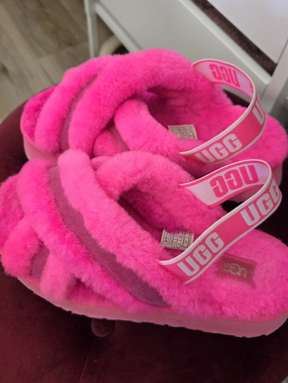 UGG pink crisscross shearling straps of the UGG Disco Cross Slide.